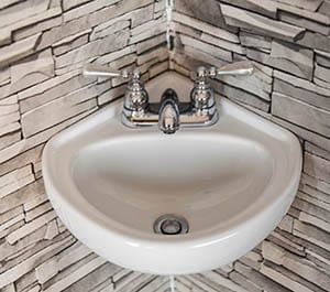 Corner wall mount sink