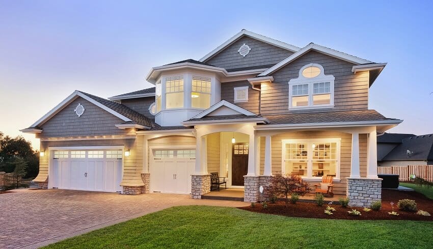 Grey and white facade of a house with open porch