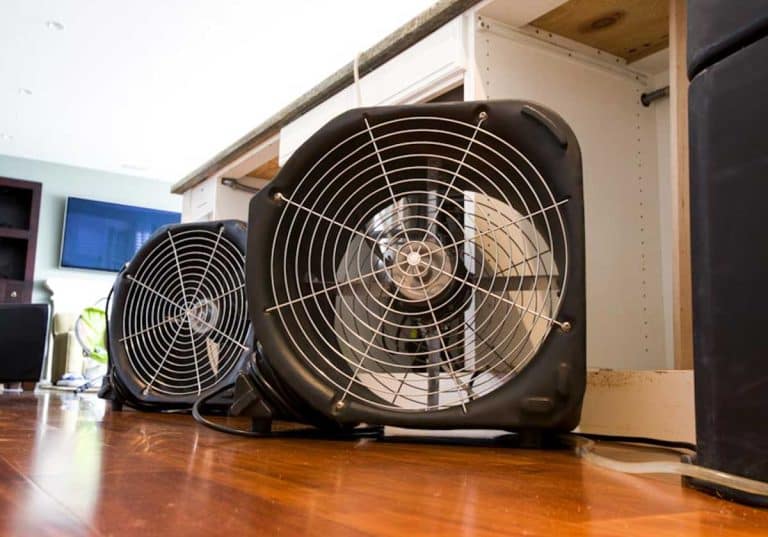 home interior with wood floor and box fans as ceiling fan alternatives