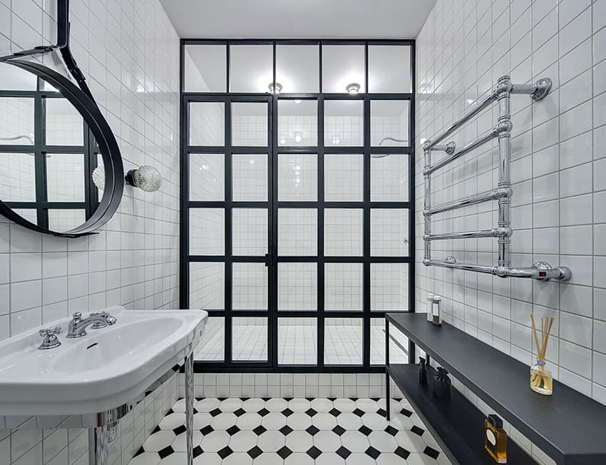 White tile bathroom shower with black frame